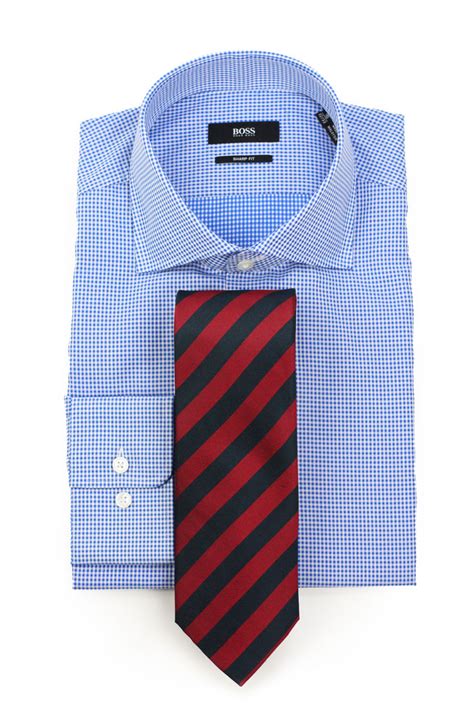 checkered shirt with striped tie.